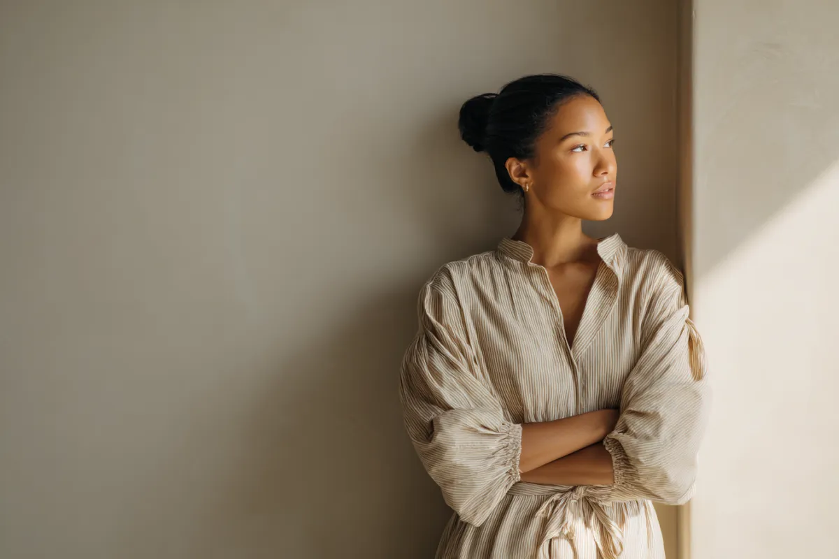 Women standing in front of window with arms crossed