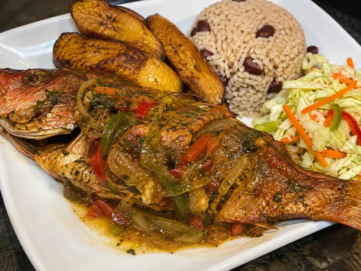 Whole seasoned Caribbean red snapper with savory brown rice and creole sauce