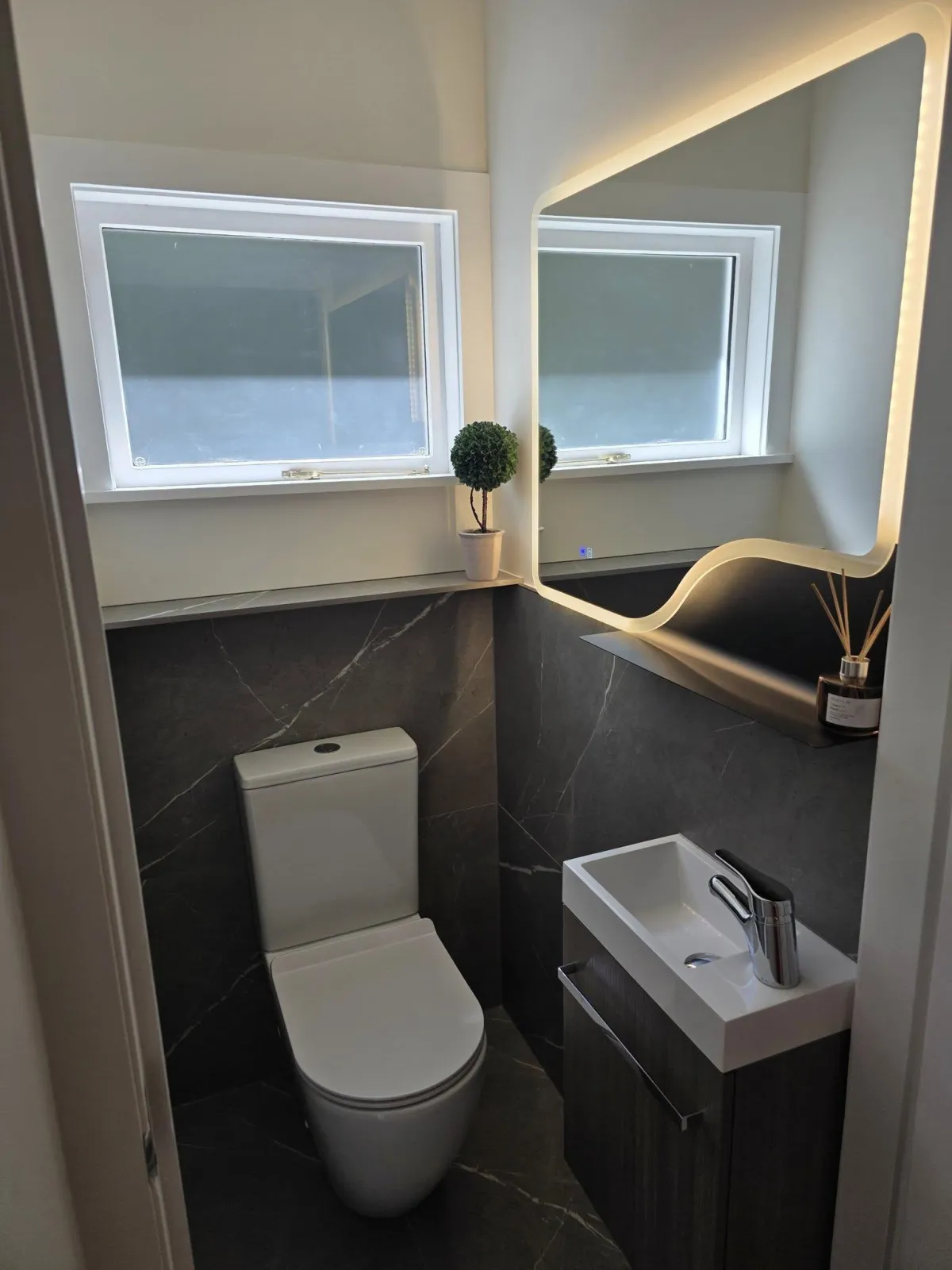 Compact bathroom renovation with toilet and vanity in Wellington