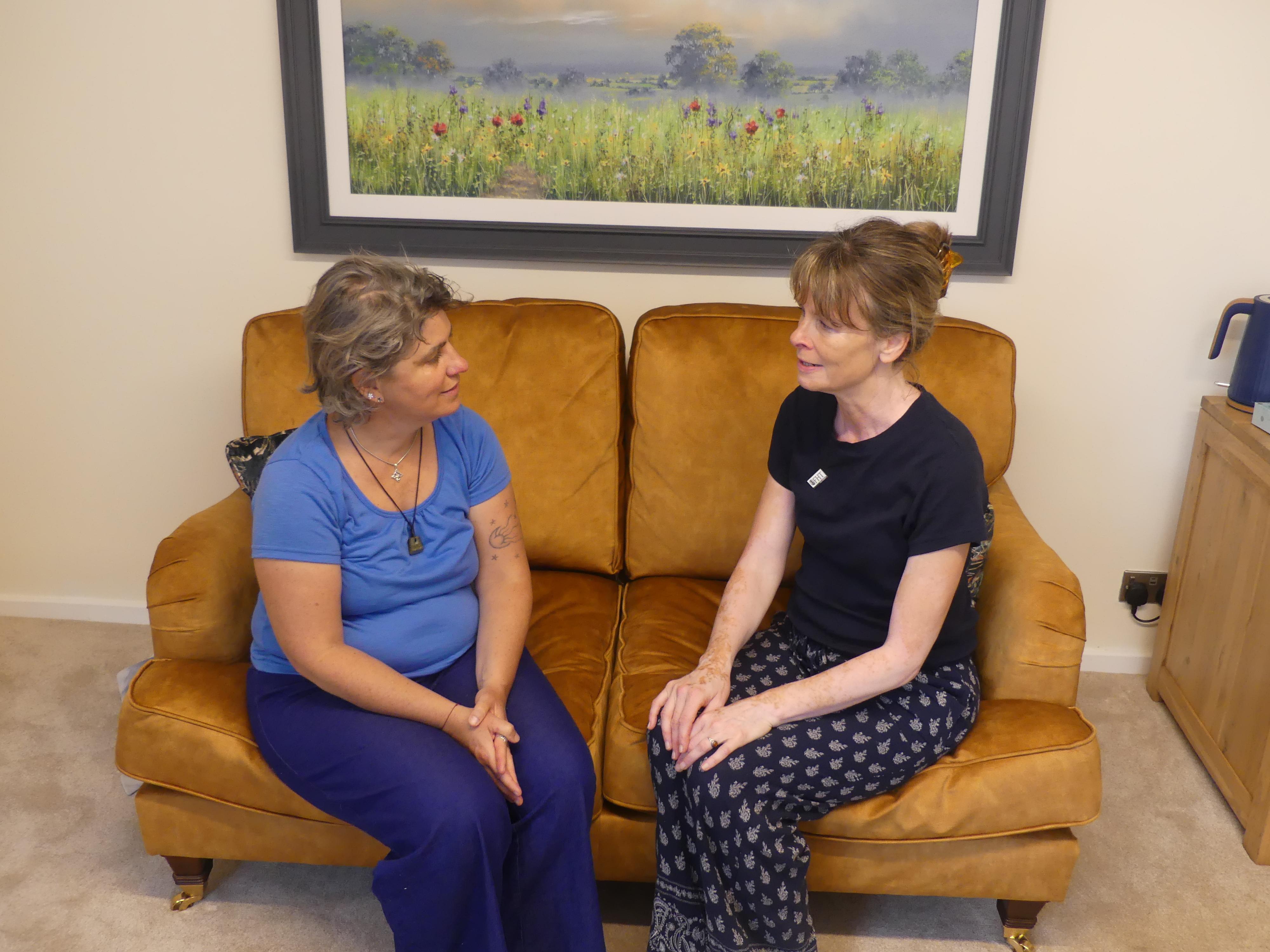 A photo of iHilary Dancing Energy Healer discussing treatment with a client at the Oldgate Therapy Centre, Morpeth