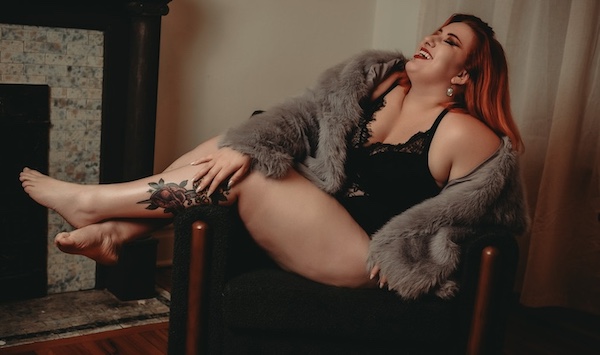 Plus sized woman wearing lingerie and fur