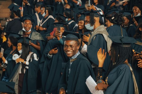 College graduates celebrating graduation representing legal protection for college-bound students and families