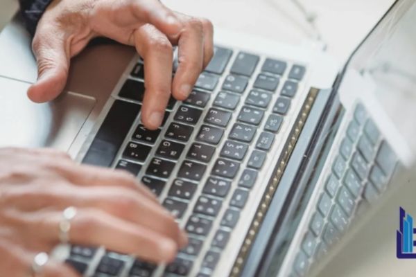 Professional completing secure online identity verification and remote notarization on laptop