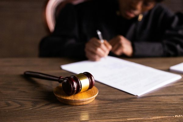 Court-appointed commissioner witnessing sworn testimony and legal affidavit signing for Florida probate case