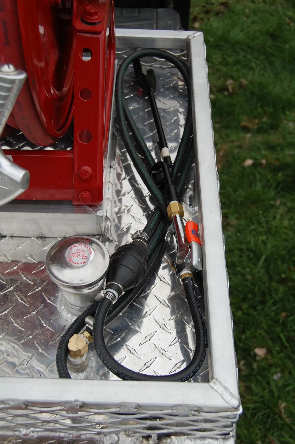 Southern Rough UTV fire unit integrated burn mix tank with Panama wand ignition system neatly stored in diamond plate aluminum compartment