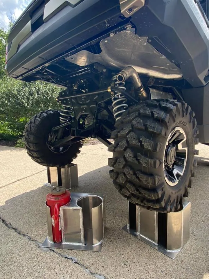 Southern Rough drip torch holders strength test with fully boxed aluminum construction holding up a UTV to prove rugged field-ready durability