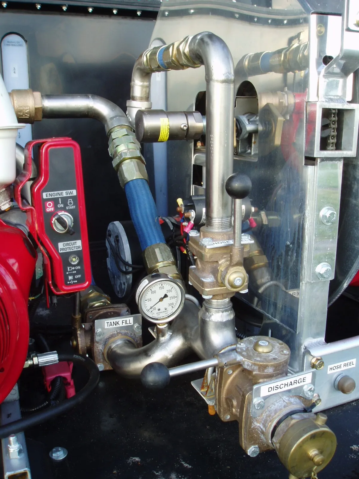 Southern Rough fire engine pump panel featuring seamless stainless plumbing, Akron brass gate valves, 300 PSI gauge, and labeled operator controls