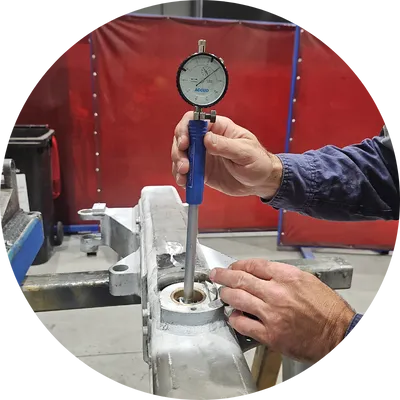 Dial bore gauge being used to measure rod support