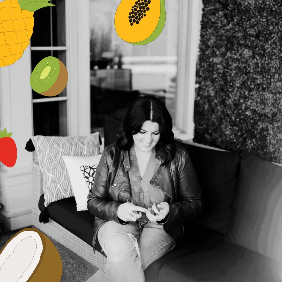 an orange and white cat laying on top of a pile of papers