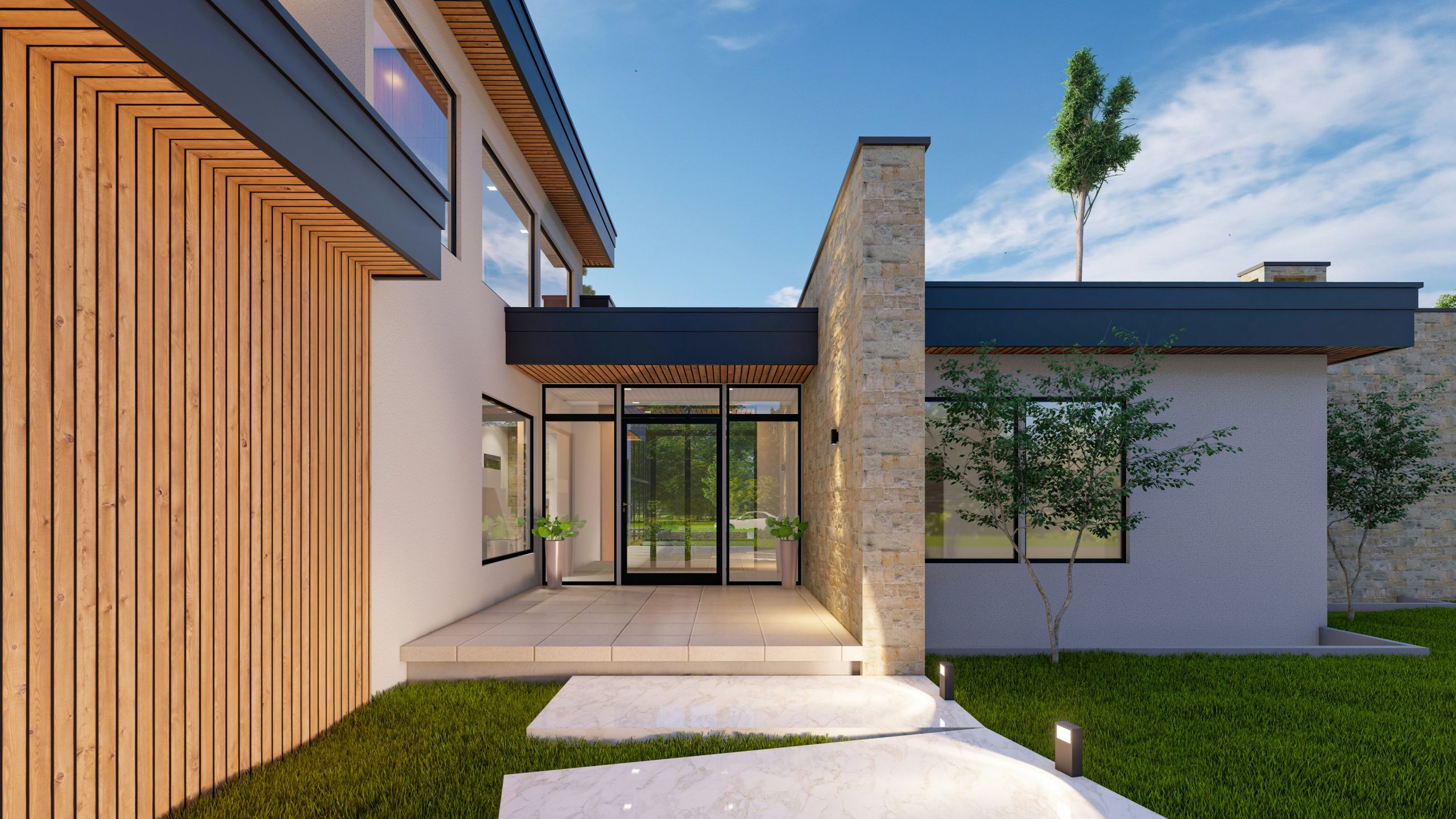 A modern single-storey home entry with a stone feature wall, glass front doors, a tiled porch and a lawn path under a bright blue sky