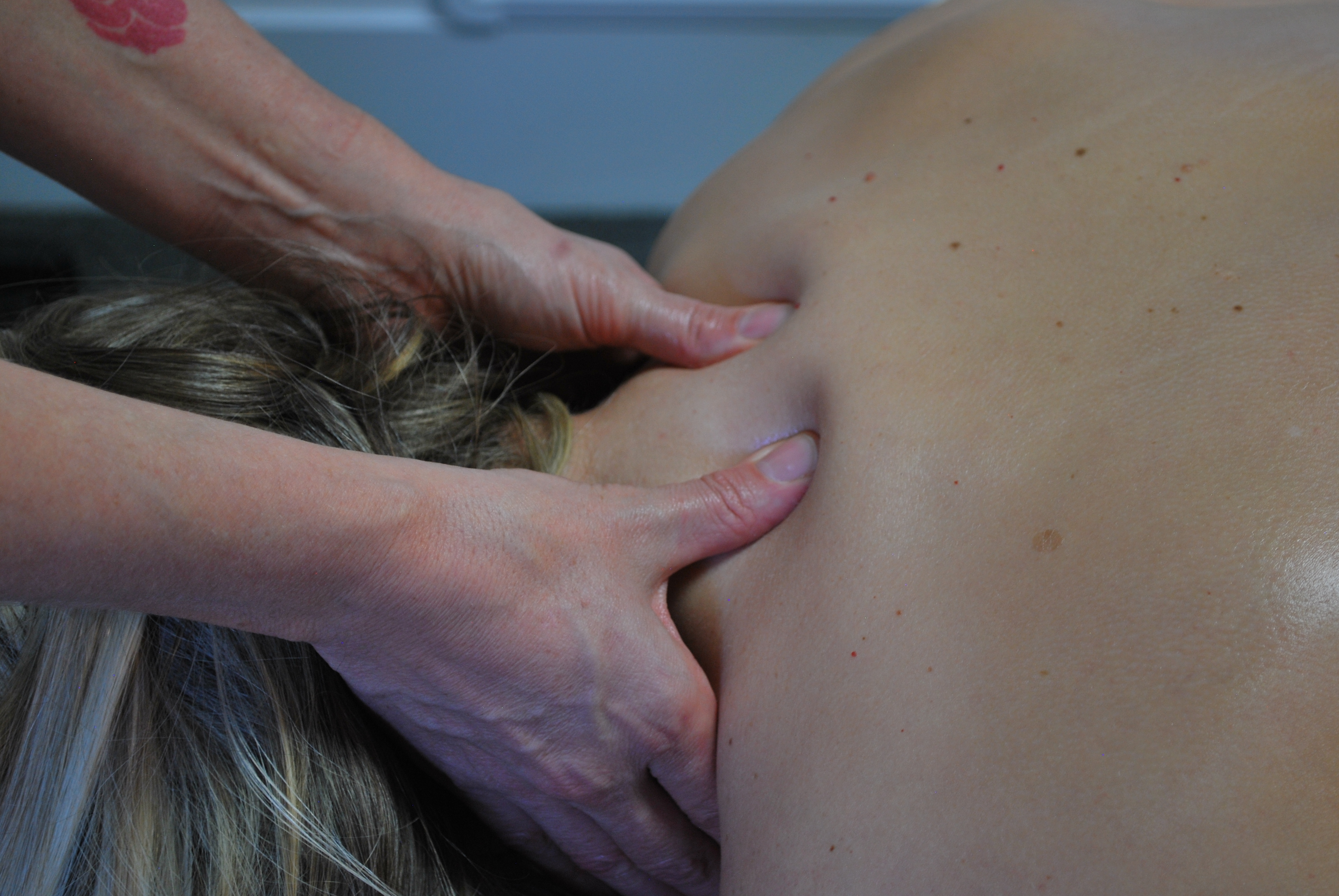 Deep tissue massage targeting upper back tension in South Jordan Utah