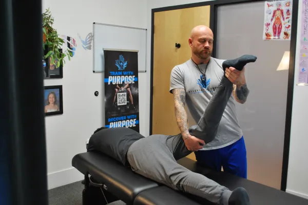 Assisted stretching session at Alleviating Hands clinic to improve mobility and reduce pain