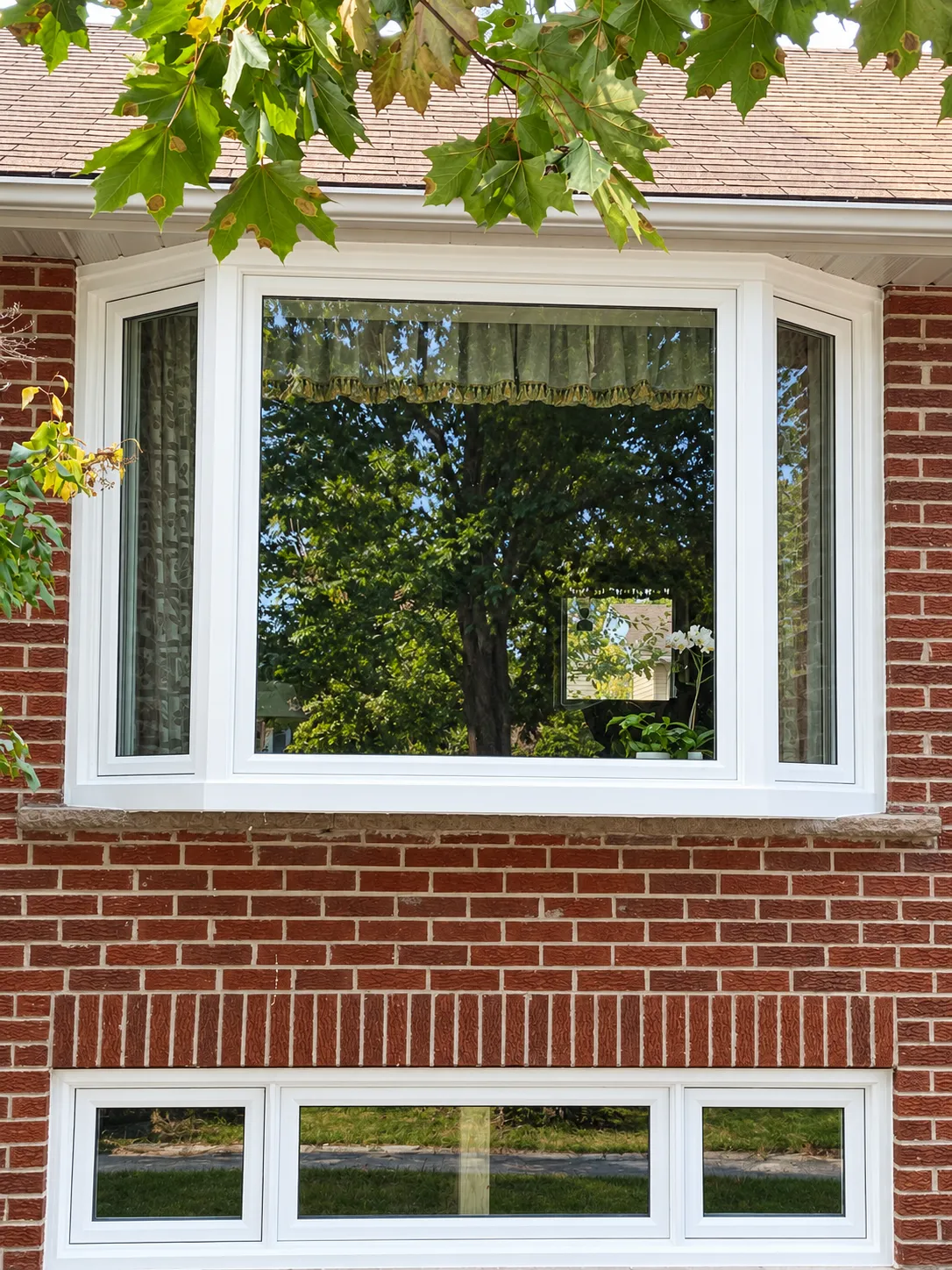 Modern GTA home exterior with newly installed black-frame windows and front door