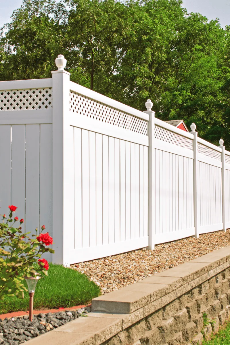 Example of white wood fence install in GA done by Catalan Landscaping for specific service page