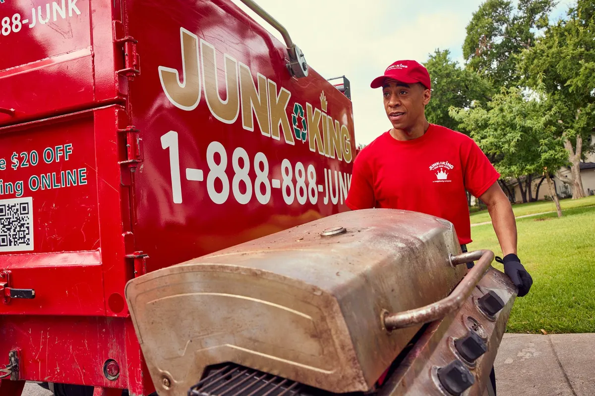 a trash can sitting in the middle of a parking lot