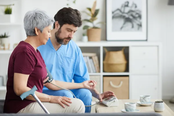 Infrared sauna interior with warm red lighting, wooden benches, and a relaxing atmosphere, promoting wellness and detoxification at Zel Vitality.