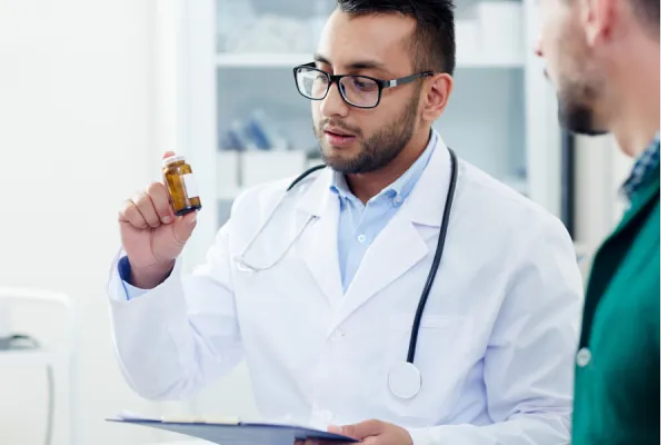 Infrared sauna interior with warm red lighting, wooden benches, and a relaxing atmosphere, promoting wellness and detoxification at Zel Vitality.