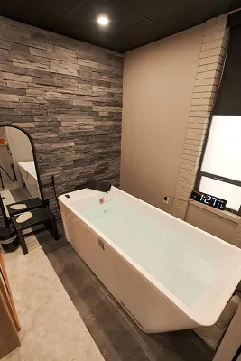 Person meditating in a serene outdoor setting, focusing on mindfulness and well-being, reflecting holistic health principles of Zel Vitality's Thrive 6 program.