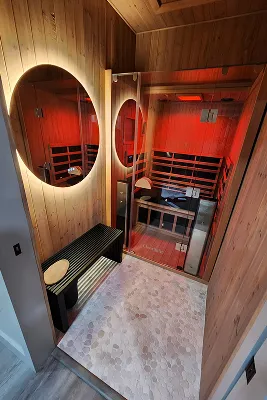 Healthcare professional in blue gloves performing acupuncture on a patient's back, emphasizing holistic wellness and mind-body support in weight loss programs.