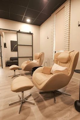 Woman enjoying a healthy salad while relaxing on a wooden deck, emphasizing wellness and nutrition in a natural setting.