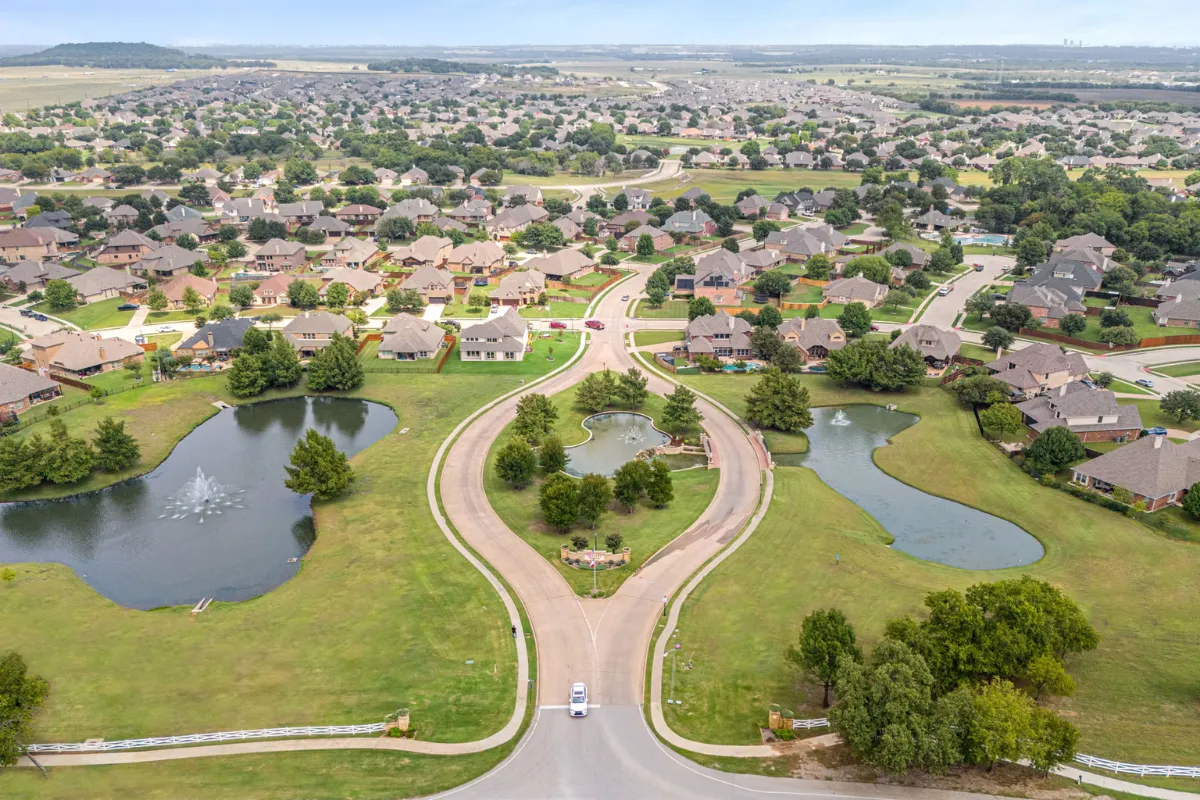 Entrance and ponds at Country Lakes subdivision in Argyle, Texas