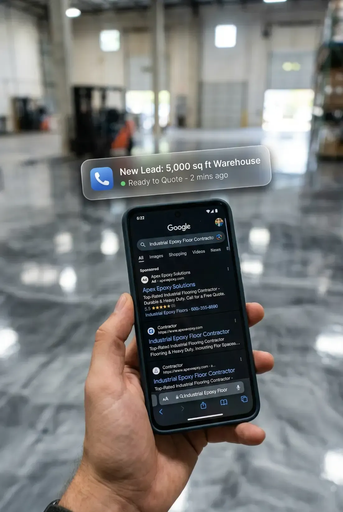: A close-up, results-focused photograph in an industrial warehouse setting with a polished metallic-marble epoxy floor. A hand holds a modern smartphone in the foreground, displaying a Google search results page for "Industrial Epoxy Floor Contractor" with "Sponsored" ads. Floating above the phone screen is a high-end, translucent, glass-morphism style notification bubble. The notification includes a "Phone Call" icon and displays the clear, specific text: "NEW LEAD: 5,000 sq ft Warehouse." This visual illustrates the direct connection between effective Google Ads management and immediate, high-value incoming project leads.