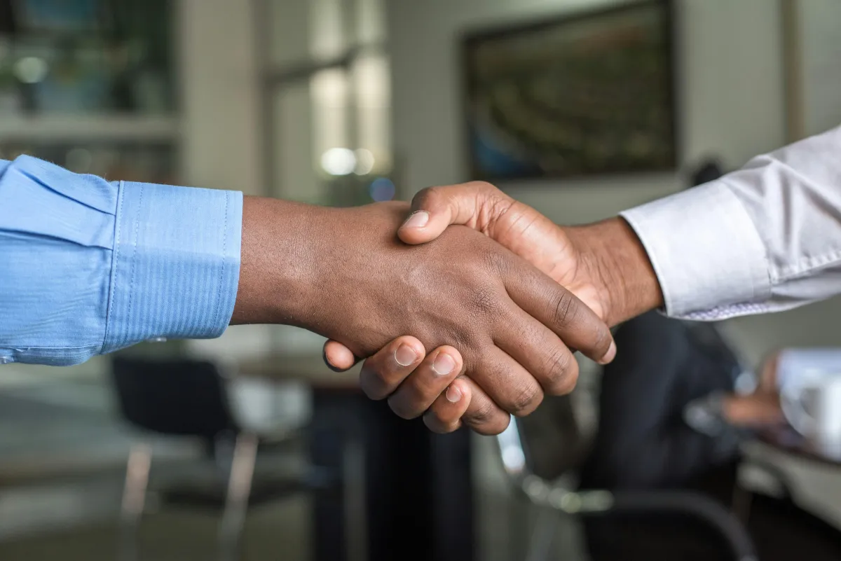 Handshake - two people shaking hands.