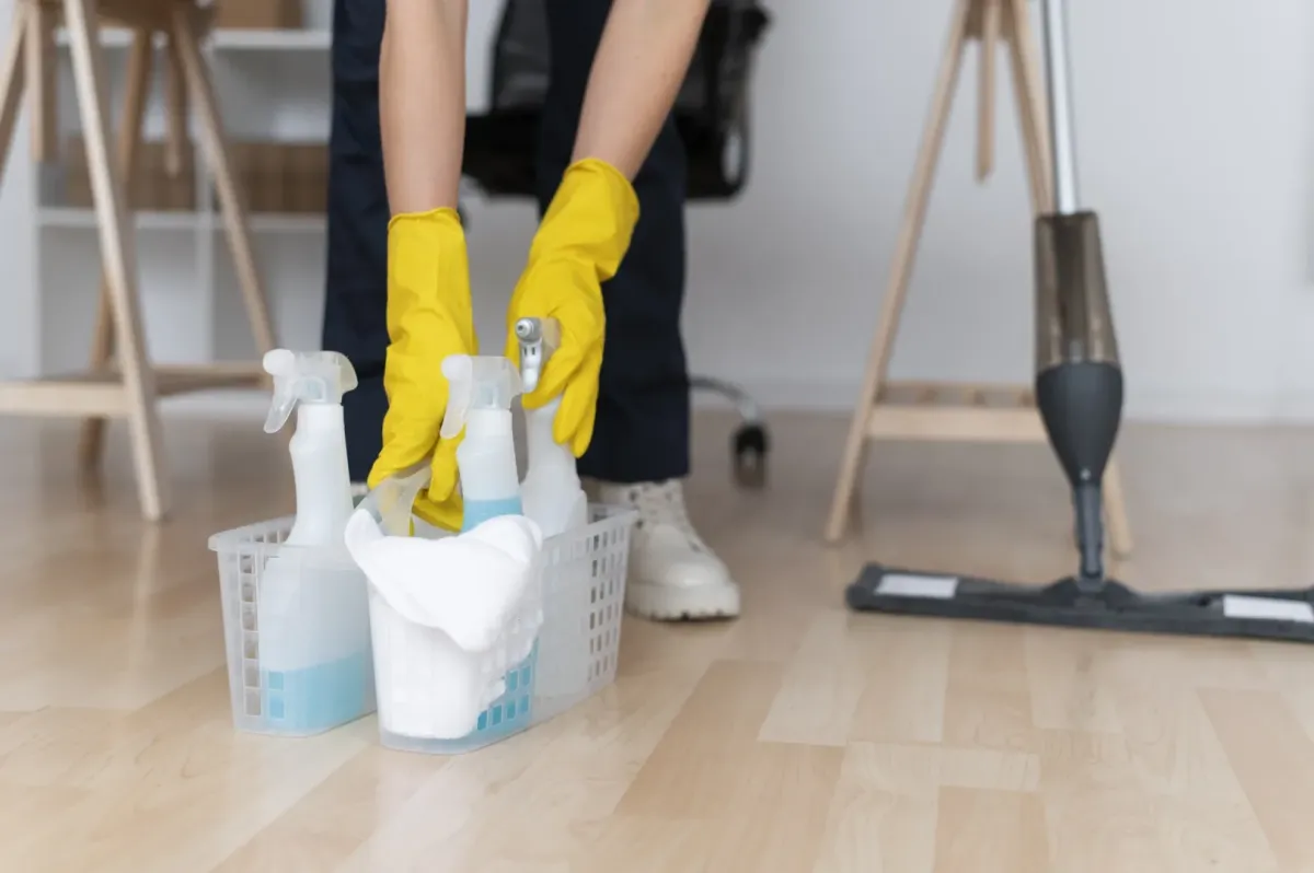 a person with cleaning equipment 