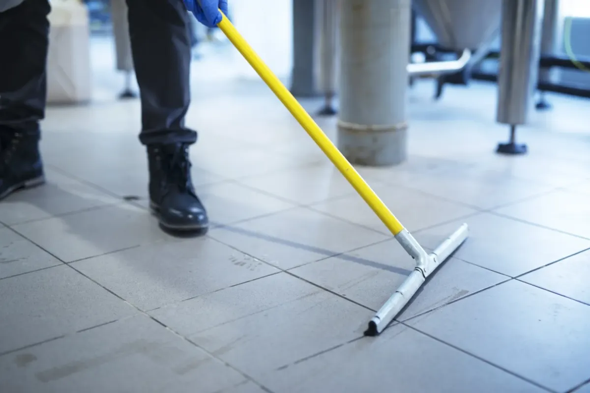 a person mopping the floor 