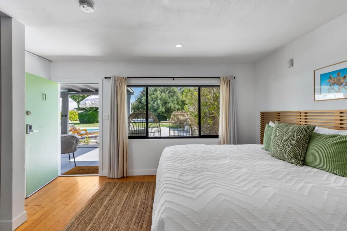 Private resort accommodations at Cosmic Activation Retreat, featuring king-size beds, a pool, hot tub, mountain views, and exclusive wellness gifts.