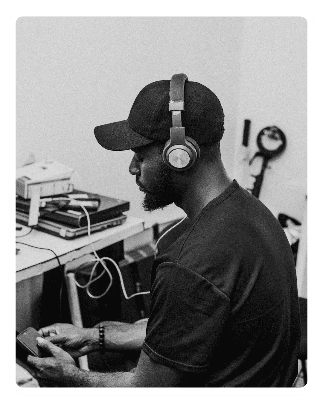 Person listening to audio content with headphones while accessing digital media resources from EVT Educational Productions