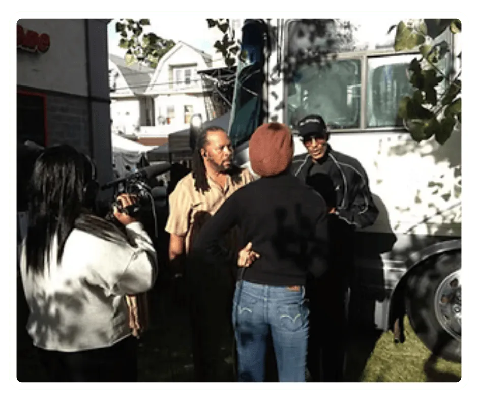 Filming an on-location interview using professional video equipment during EVT media training program