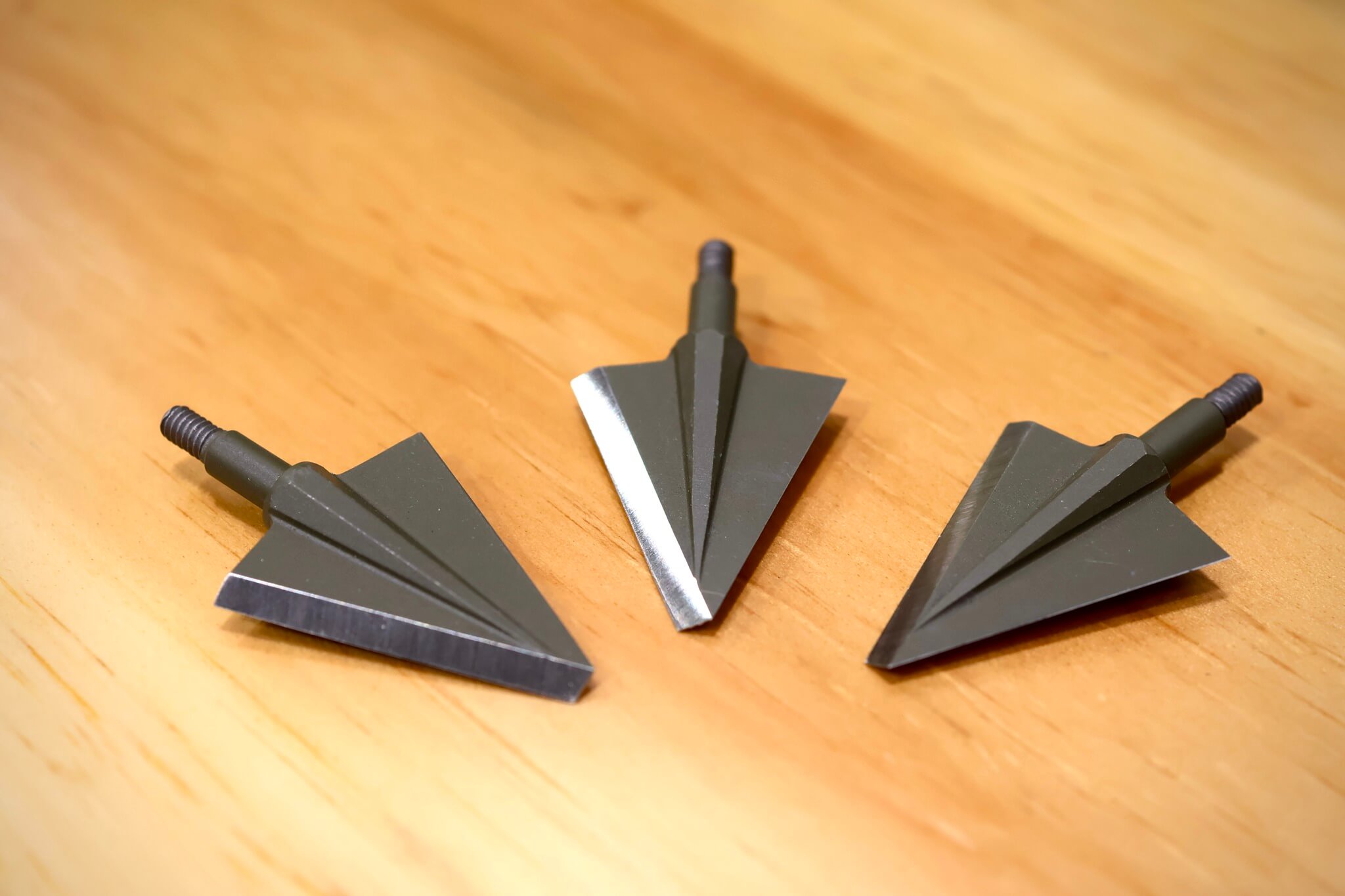 Three broadhead arrow tips