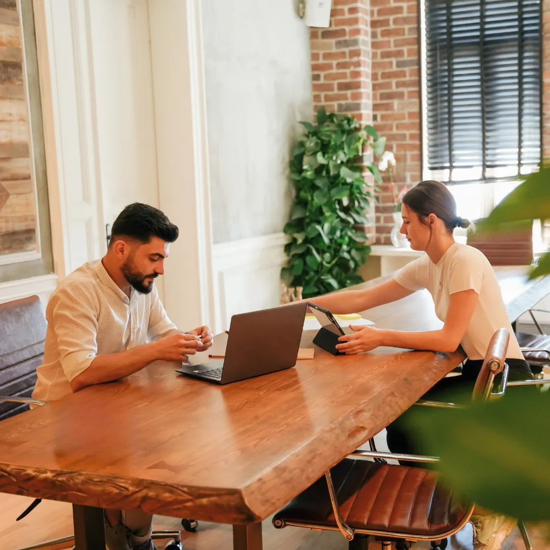 a white desk with a laptop on top of it