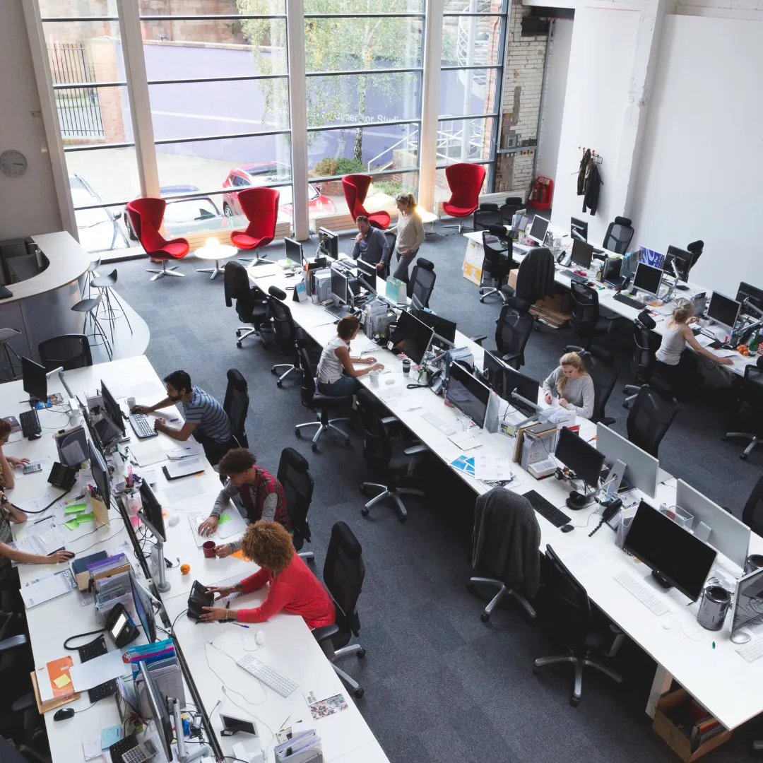 blue covered book on white table with armchair in front