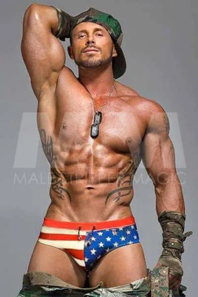  Male stripper Sebastian with a military theme, tribal tattoos, and american flag underwear