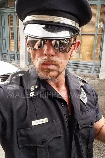 Male stripper Sebastian as a cop on Bourbon Street