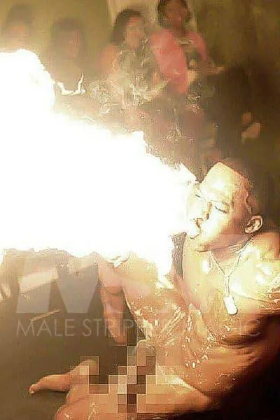 Black male stripper XL performing and blowing fire