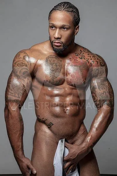 Black male stripper Pleasure post-shower holding clothing