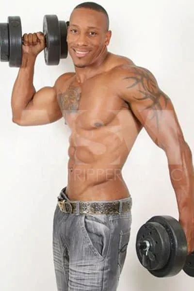 Black male stripper Dante lifting weights during a photoshoot
