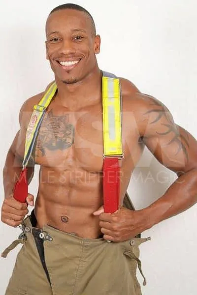 Black male stripper Dante shirtless in fireman gear showing tattoos
