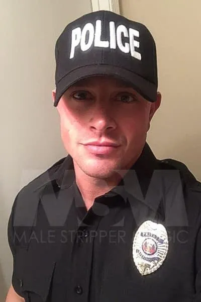 Male stripper Dean's headshot in police officer costume