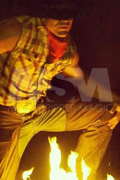 Male stripper Jake performing with fire in cowboy attire