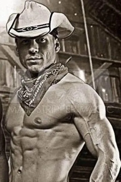 Black and white photo of male stripper Jake in a barn