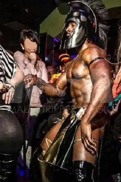 Black male stripper Dream in Spartan attire for a male revue