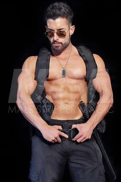  Male stripper Pauley in police-themed attire, with sunglasses and SWAT vest