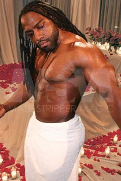 Black male stripper Midnight in a romantic bedroom setting