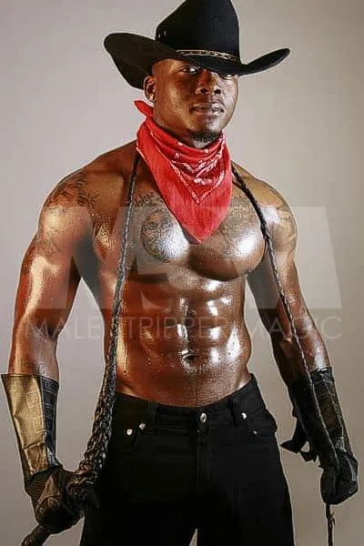 Black male stripper Incredible in cowboy attire with a bullwhip