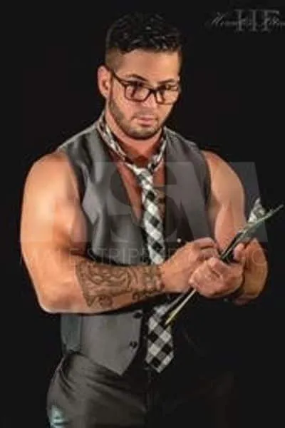Male stripper Dominic in teacher costume with a clipboard