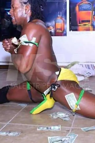 Black male stripper Kingston performing at a male revue Jamaican colors